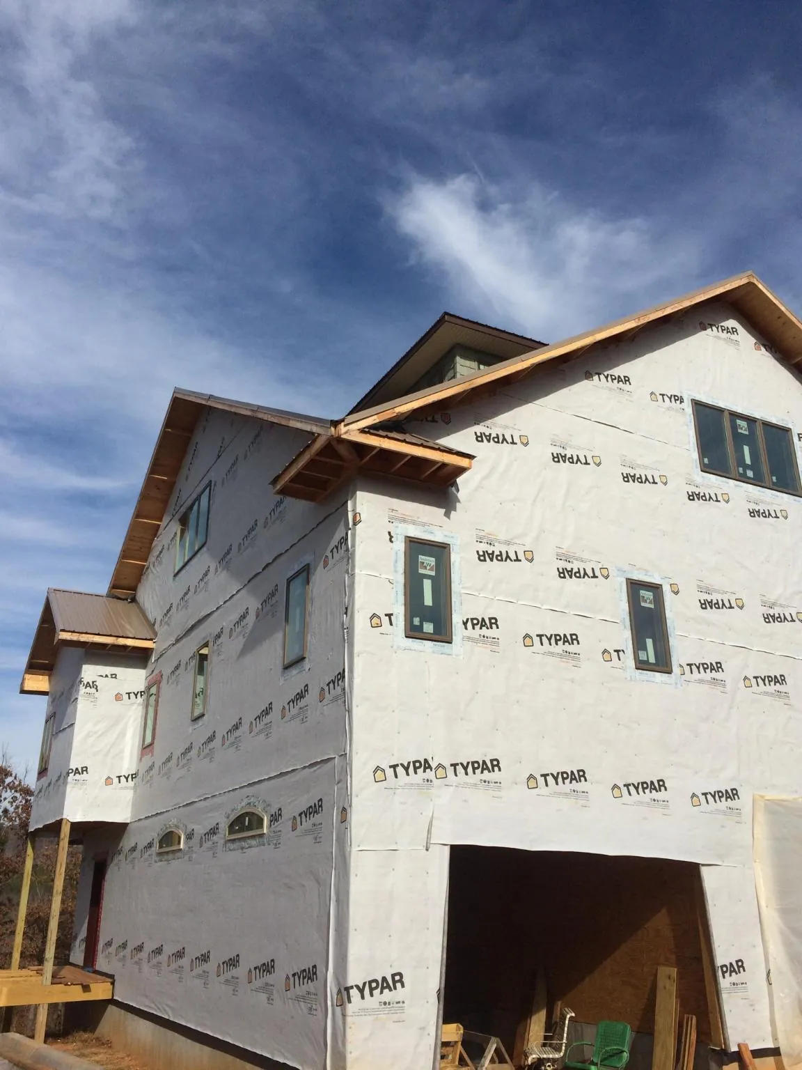 Stick built house wrapped in Typar with new roof framing and dormers in Rhododendron